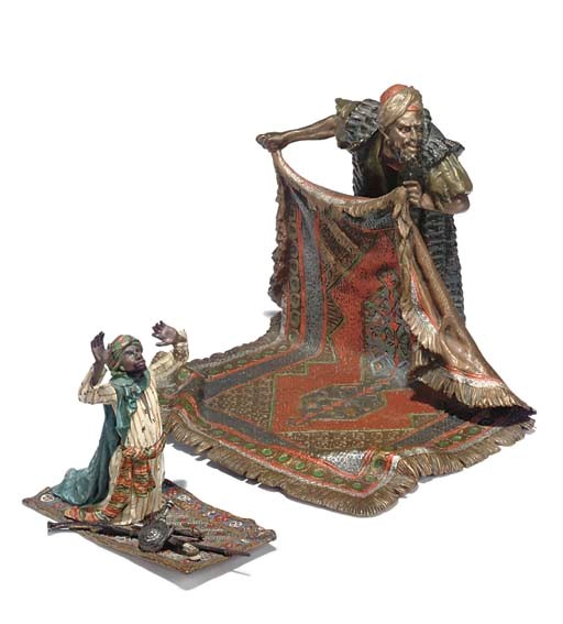 A VIENNESE COLD PAINTED BRONZE FIGURE OF A CARPET SELLER