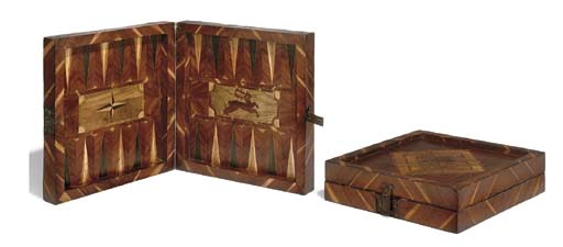 A PROVINCIAL GERMAN FRUITWOOD, WALNUT AND OAK VENEERED FOLDING GAMES BOARD
