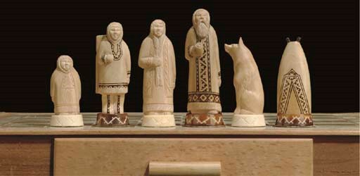 AN INUIT MARINE IVORY FIGURAL CHESS SET