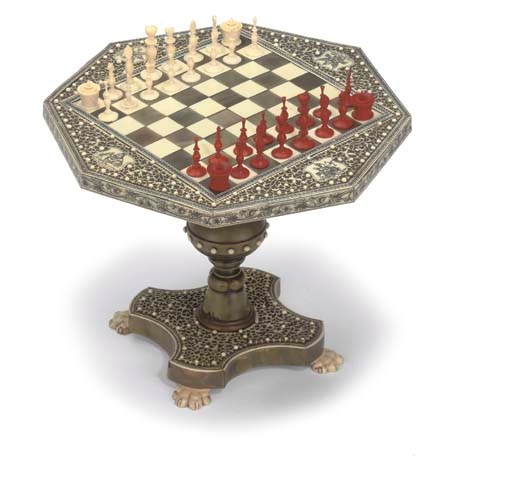 AN ANGLO-INDIAN IVORY INLAID AND HORN VENEERED MINIATURE CHESS TABLE
