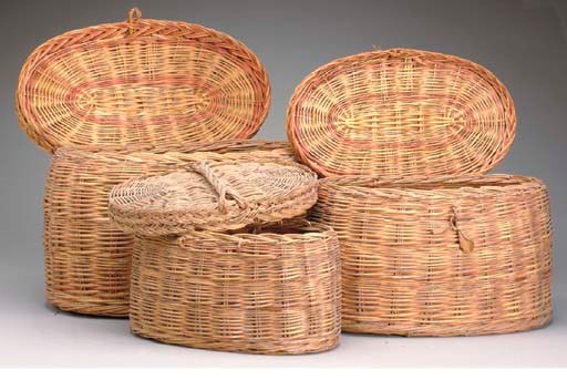 A NEST OF THREE WOVEN BASKETS,