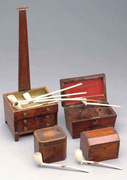 A GROUP OF THREE ENGLISH TEACADDIES AND AN AMERICAN PIPE STAND WITH PIPES,