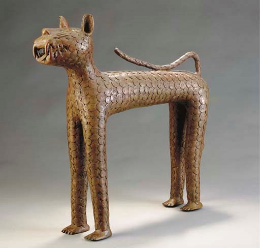 A BENIN STYLE BRONZE MODEL OF A LEOPARD,