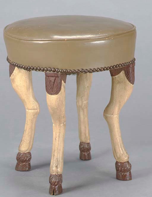 A 'DEER HOOF' CARVED LEATHER UPHOLSTERED CIRCULAR STOOL,