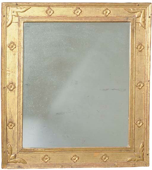 A CONTINENTAL CARVED GILTWOOD AND COMPOSITION WALL MIRROR,