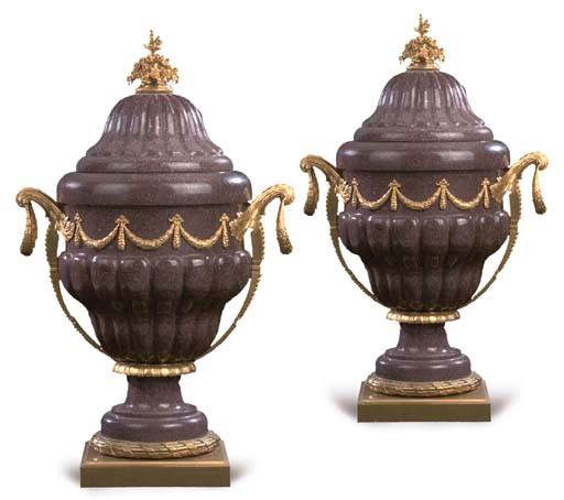 A pair of large Louis XVI style ormolu-mounted simulated porphyry urns and covers
