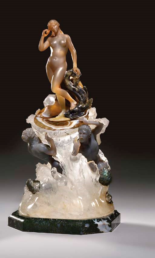 A fine Italian carved chalcedony, labradorite, agate, rock-crystal and green jasper figural group depicting the birth of Venus, in original display case