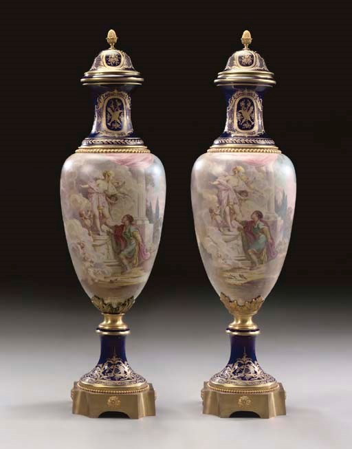 A large pair of ormolu-mounted Sevres style cobalt-blue ground vases and covers