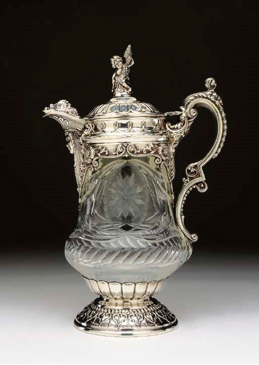 A SILVER-MOUNTED GLASS CLARET JUG,