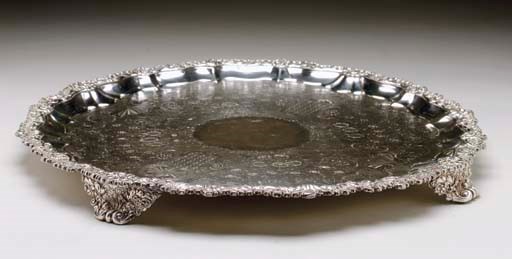 A SILVER-PLATED CIRCULAR FOOTED TRAY,