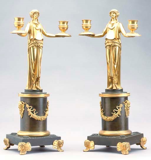 A PAIR OF EMPIRE STYLE GILT AND PATINATED BRONZE TWO-LIGHT FIGURAL CANDELABRA,