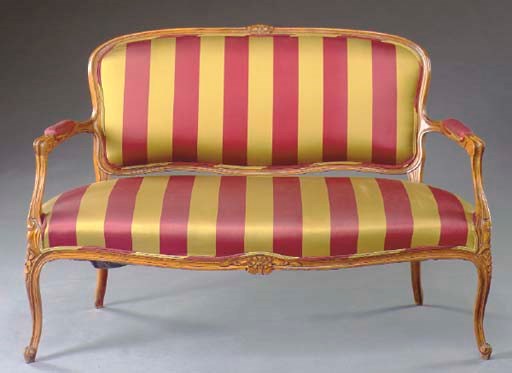 A LOUIS XV STYLE CARVED WALNUT SETTEE,
