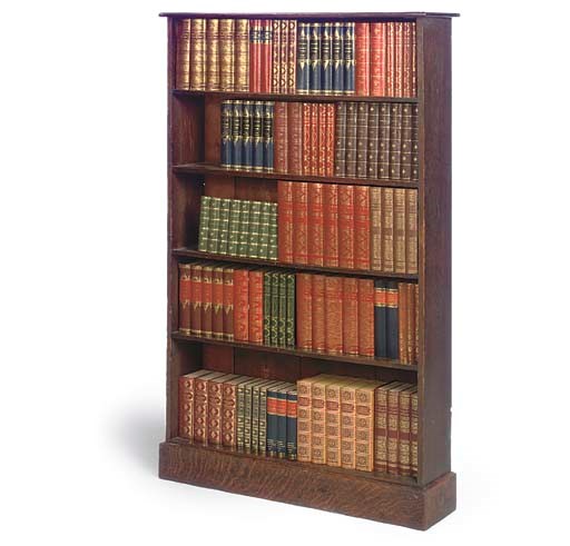 AN EDWARDIAN OAK OPEN BOOKCASE