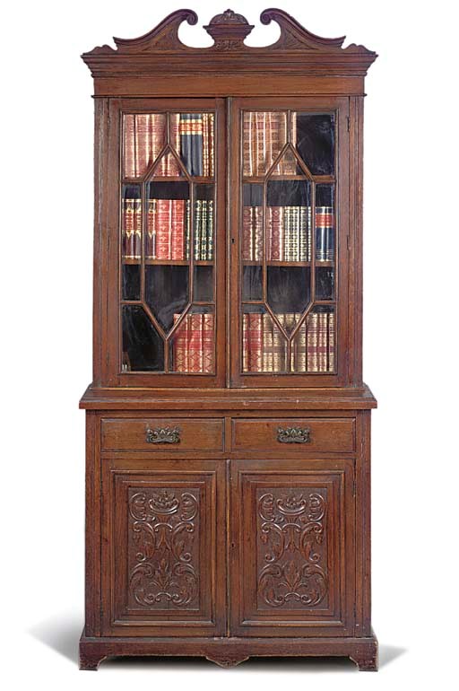 A LATE VICTORIAN OAK BOOKCASE