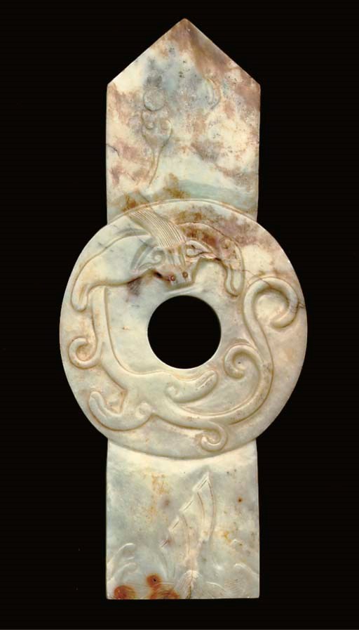 A Chinese mottled creamy and russet jade tablet, 17th century