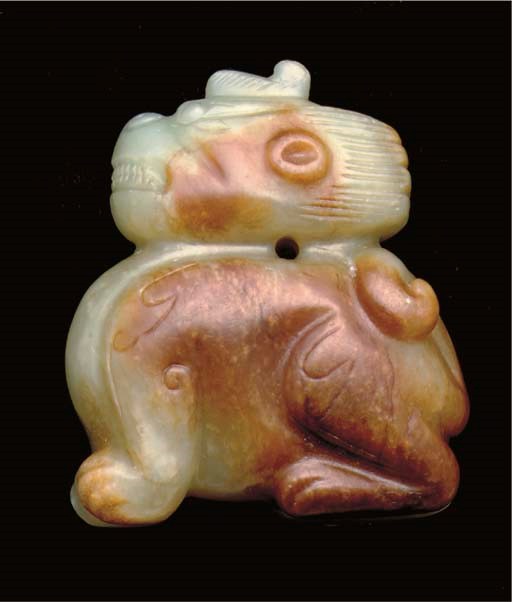 A celadon and brown jade model of a mythical beast, Song/Ming dynasty