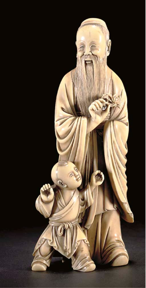 An ivory carving of a sage and child, 19th Century