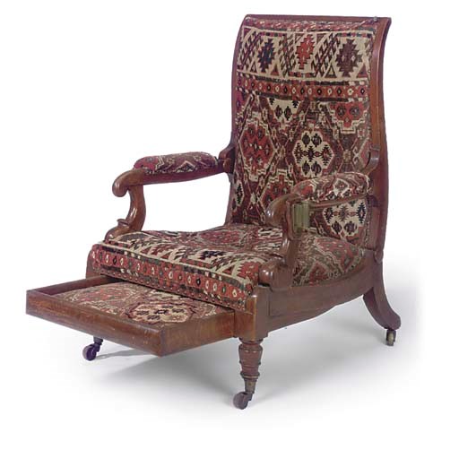A GEORGE IV OAK RECLINING ARMCHAIR