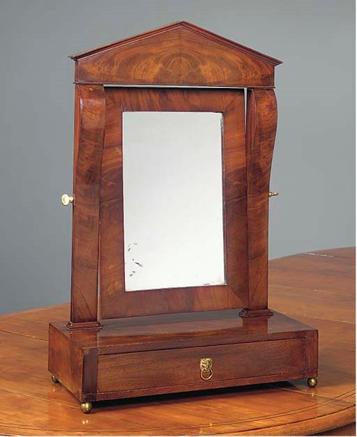 A GERMAN BIEDERMEIER MAHOGANY DRESSING MIRROR