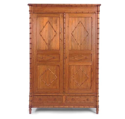 A FRENCH STAINED PINE ARMOIRE