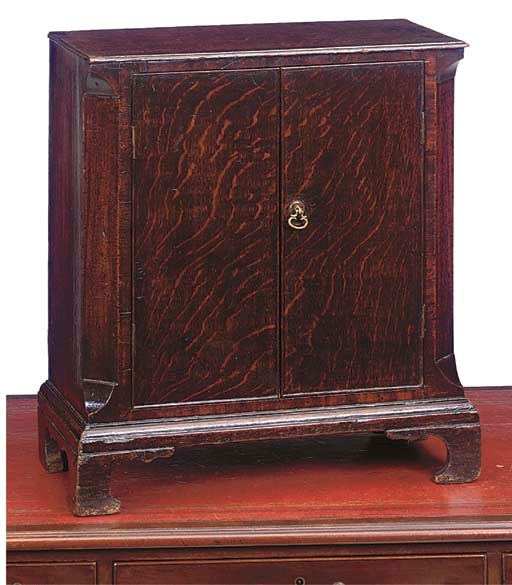 AN OAK TABLE CUPBOARD