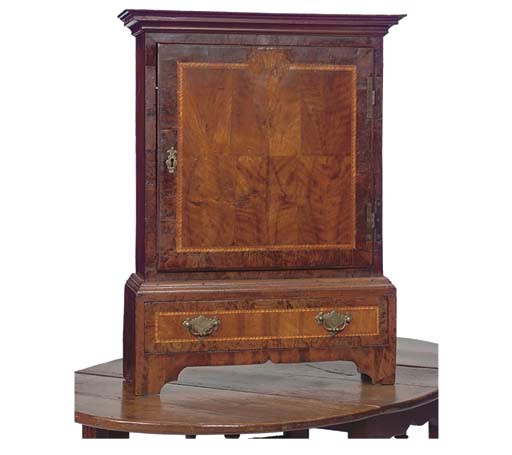 A NORTH EUROPEAN WALNUT AND POLLARD OAK TABLE CABINET