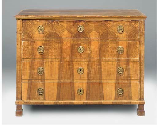 AN AUSTRIAN FIGURED WALNUT COMMODE