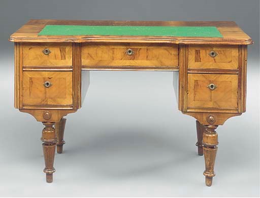 AN AUSTRIAN WALNUT KNEEHOLE DESK