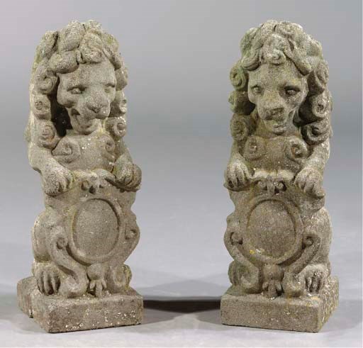 A PAIR OF COMPOSITE STONE LIONS