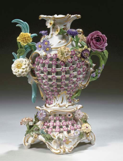 A Meissen-style porcelain flower-encrusted ajour potpourri vase