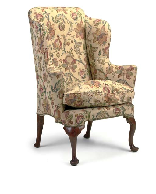A GEORGE I WALNUT WING ARMCHAIR