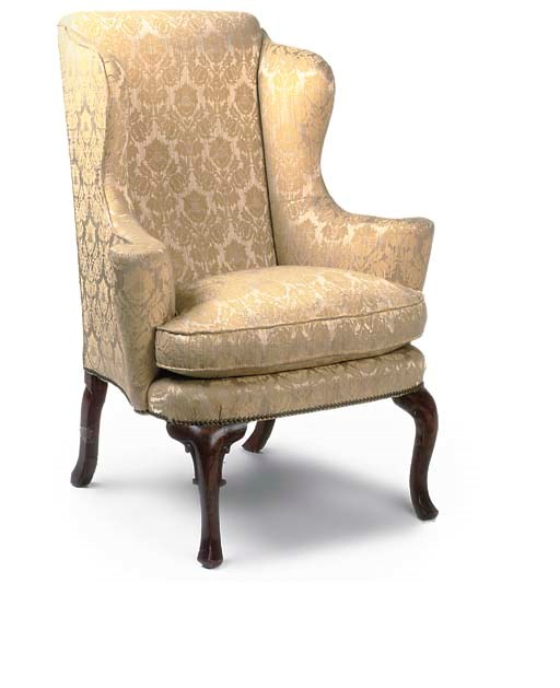 A GEORGE I WALNUT WING ARMCHIAR