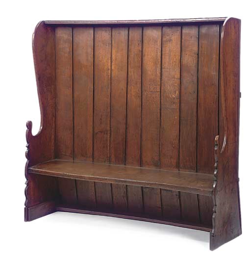 A WEST COUNTRY OAK HIGH BACK WINGED SETTLE