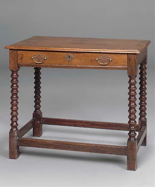 A NORTH EUROPEAN OAK AND CHESTNUT SINGLE DRAWER SIDE TABLE