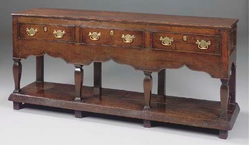 A MONTGOMERYSHIRE OAK THREE DRAWER DRESSER