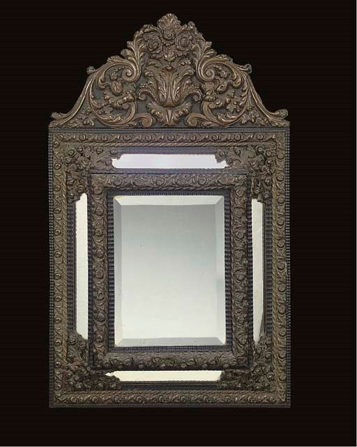 A DUTCH REPOUSSE METAL MIRROR