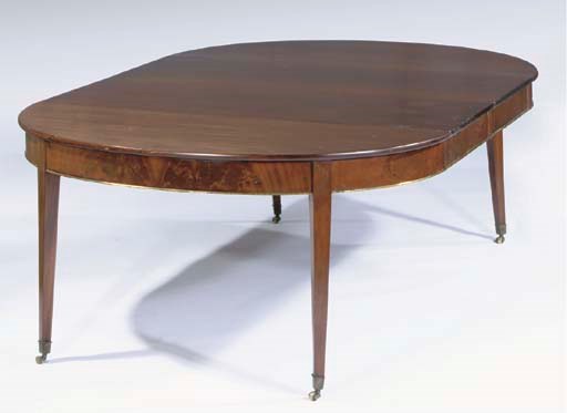 A DUTCH MAHOGANY EXTENDING DINING-TABLE