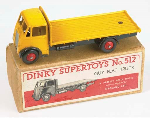 A Dinky yellow 512 Guy Flat Truck