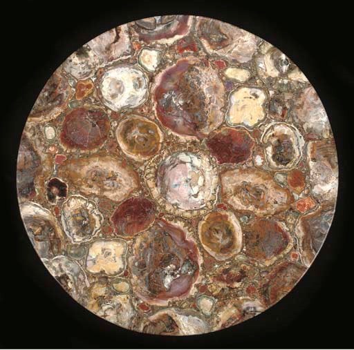 A large composite petrified wood table top,