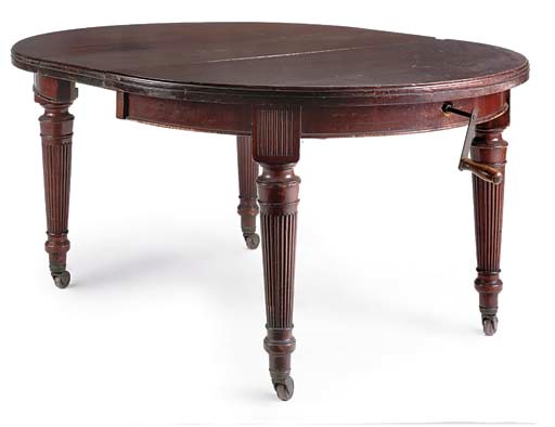 A LATE VICTORIAN EXTENDING DINING TABLE