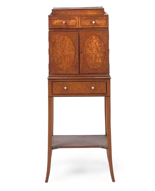 A SATINWOOD COLLECTOR'S CABINET ON STAND