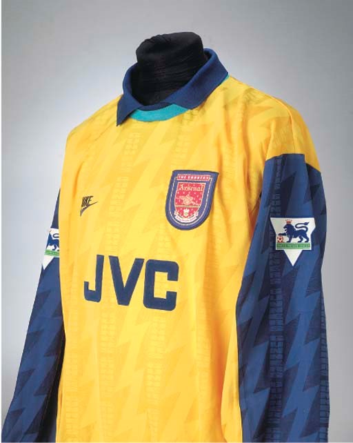 A YELLOW AND BLUE ARSENAL SHIRT