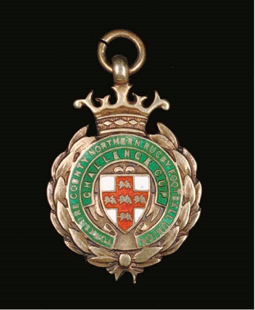 A SILVER-GILT AND ENAMEL CHALLENGE CUP WINNERS MEDAL