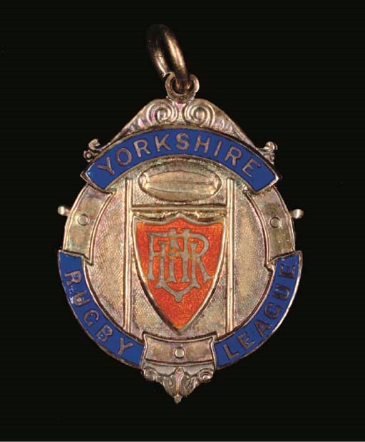 A SILVER-GILT AND ENAMEL RUGBY LEAGUE MEDAL