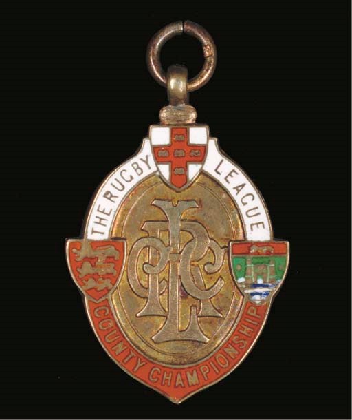 A SILVER-GILT AND ENAMEL RUGBY LEAGUE MEDAL