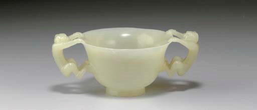 A SMALL WHITE JADE TWO-HANDLED CUP
