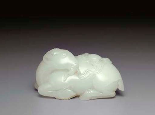 A SMALL WHITE JADE CARVING OF A RAM