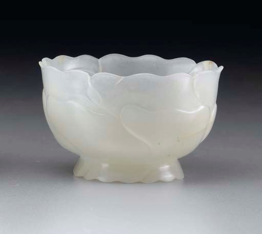 A SMALL WHITE JADE FLOWER-FORM CUP