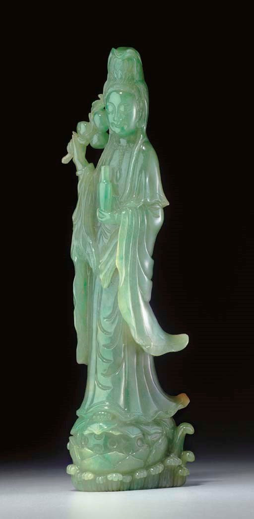 A GREEN JADEITE FIGURE OF GUANYIN