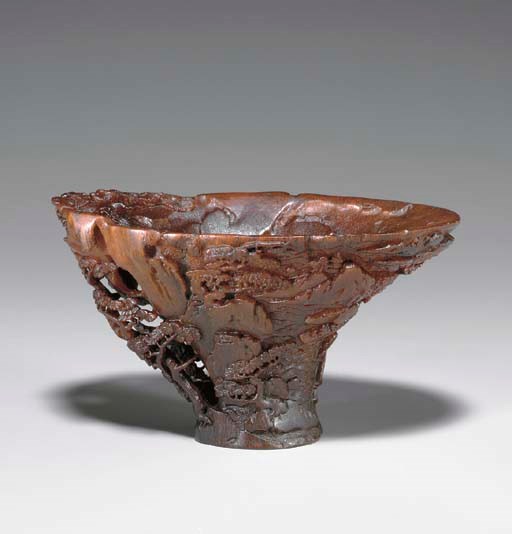 **A LANDSCAPE-CARVED RHINOCEROS HORN LIBATION CUP